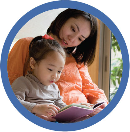 A woman reading to a child